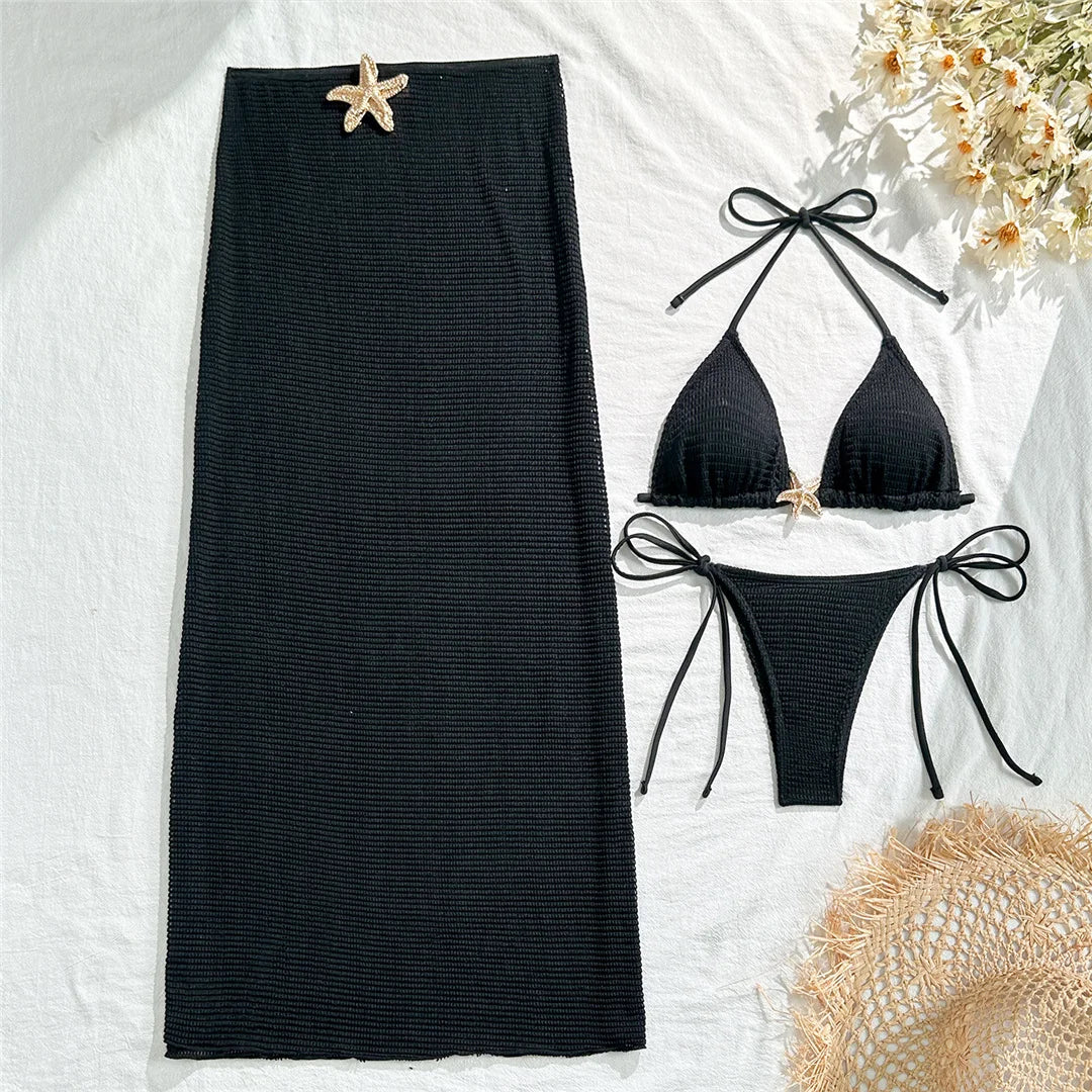 Ropa de playa con biquini y detalle de estrella
