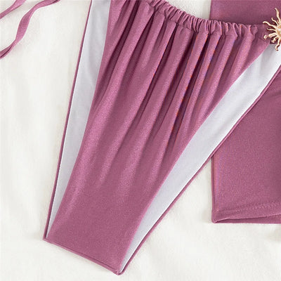 Biquini morado con minifalda y sol metálico